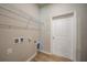 Laundry room showcasing hookups and metal shelving for storage at 18503 Ellen Ave, Port Charlotte, FL 33948