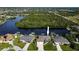 Waterfront home with lush landscaping, boat docks, and tranquil water views from above at 19246 Moore Haven Ct, Port Charlotte, FL 33948