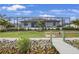 Spacious backyard with lush landscaping, a private dock, and a screened-in lanai, perfect for outdoor entertaining at 19246 Moore Haven Ct, Port Charlotte, FL 33948