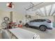 Spacious three-car garage providing ample parking and storage space, including extra bicycles at 19246 Moore Haven Ct, Port Charlotte, FL 33948