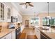 Bright kitchen with granite countertops, stainless steel appliances, and a view to the outdoor lanai and waterway at 19246 Moore Haven Ct, Port Charlotte, FL 33948