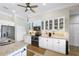 Bright kitchen featuring white cabinets, granite countertops, modern appliances, and ample storage space at 19246 Moore Haven Ct, Port Charlotte, FL 33948
