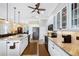 Modern kitchen featuring white cabinets, granite countertops and stainless steel appliances at 19246 Moore Haven Ct, Port Charlotte, FL 33948