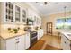 Kitchen with granite countertops, stainless steel appliances, decorative backsplash, and adjacent breakfast nook at 19246 Moore Haven Ct, Port Charlotte, FL 33948