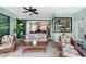 Cozy outdoor lanai with comfortable seating, tile flooring, and seamless access to the kitchen and living areas at 19246 Moore Haven Ct, Port Charlotte, FL 33948