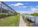 Beautiful waterfront home featuring a private dock, lush landscaping, and easy access to the water at 19246 Moore Haven Ct, Port Charlotte, FL 33948