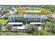 Aerial view of condo buildings, a pond, and covered parking at 2160 Heron Lake Dr # 201, Punta Gorda, FL 33983