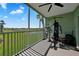 Screened balcony with workout equipment and views of the pond at 2160 Heron Lake Dr # 201, Punta Gorda, FL 33983