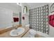 Bathroom with modern decor, a shower with black and white curtains, and a single sink vanity at 2160 Heron Lake Dr # 201, Punta Gorda, FL 33983