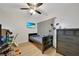 This bedroom features wood floors, a ceiling fan, and a chest of drawers at 2160 Heron Lake Dr # 201, Punta Gorda, FL 33983
