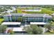 Well-maintained condo building with lush landscaping, covered parking, and a serene lake view in a desirable community at 2160 Heron Lake Dr # 201, Punta Gorda, FL 33983