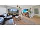 Comfortable living room with fireplace, balcony access, open to dining area, with lovely decor and bright light at 2160 Heron Lake Dr # 201, Punta Gorda, FL 33983