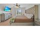 Serene main bedroom features a neutral color palette, ceiling fan and light-filled window with exterior views at 2160 Heron Lake Dr # 201, Punta Gorda, FL 33983