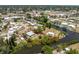Aerial view of the property on a canal, showcasing its proximity to major roads and surrounding residential area at 219 Martin Ne Dr, Port Charlotte, FL 33952