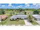 The home boasts a grey roof and a driveway leading up to the front at 2193 Beacon Dr, Port Charlotte, FL 33952