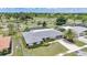 Overhead view of a well-kept single-story home, showcasing its backyard, screened-in pool, and landscaping at 2193 Beacon Dr, Port Charlotte, FL 33952