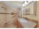 Updated bathroom features tiled walk-in shower with bench, granite vanity and updated faucet and hardware at 2193 Beacon Dr, Port Charlotte, FL 33952