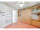 Bedroom features a built-in Murphy bed with closet and shelving units, and neutral walls at 2193 Beacon Dr, Port Charlotte, FL 33952