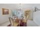 Elegant dining room featuring a chandelier, classic furniture, and access to the outdoor patio at 2193 Beacon Dr, Port Charlotte, FL 33952