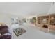 Expansive living area showcasing a neutral color palette, built-in shelving, and easy access to other living spaces at 2193 Beacon Dr, Port Charlotte, FL 33952