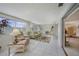Bright sunroom with tiled floors, large windows, and comfortable seating with access to lanai at 2193 Beacon Dr, Port Charlotte, FL 33952
