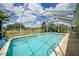 The screened pool is framed by a clear view of the sky at 2193 Beacon Dr, Port Charlotte, FL 33952