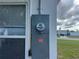 Outdoor electrical box with a visible meter and emergency disconnect switch at 230 Waterway Cir Ne, Port Charlotte, FL 33952