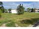 Spacious front yard provides ample room for outdoor activities at 230 Waterway Cir Ne, Port Charlotte, FL 33952