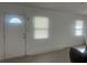 Bright living room with neutral paint, new flooring, updated door and window at 230 Waterway Cir Ne, Port Charlotte, FL 33952