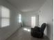 Clean and bright room with fresh paint, new flooring, and natural light at 230 Waterway Cir Ne, Port Charlotte, FL 33952