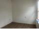 Bright room with wood flooring and a window at 230 Waterway Cir Ne, Port Charlotte, FL 33952