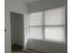 Bright room featuring a large double window and neutral walls at 230 Waterway Cir Ne, Port Charlotte, FL 33952