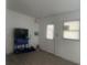 Room with modern flooring, fresh paint, and an exterior door and window at 230 Waterway Cir Ne, Port Charlotte, FL 33952