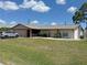 Charming single-story home with a well-manicured lawn and attached two-car garage at 23269 Lehigh Ave, Port Charlotte, FL 33954