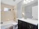 Modern bathroom with bathtub, vanity, and sleek fixtures at 2405 Mistleto Ln, North Port, FL 34286