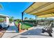Well-maintained bocce ball court with seating and a shaded awning, perfect for outdoor activities at 25100 Sandhill Blvd # F-203, Punta Gorda, FL 33983