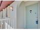 Close-up of a condo front door with the unit number and entryway architectural details at 25100 Sandhill Blvd # F-203, Punta Gorda, FL 33983