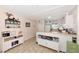 Cozy kitchen with charming decor and a view of the breakfast bar at 25100 Sandhill Blvd # F-203, Punta Gorda, FL 33983