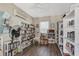 Cozy library room with floor to ceiling shelving and lots of natural light from the window at 25100 Sandhill Blvd # F-203, Punta Gorda, FL 33983