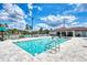 Community pool featuring clear water and comfortable seating perfect for relaxation at 25100 Sandhill Blvd # F-203, Punta Gorda, FL 33983