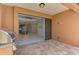 Covered patio area with an open view of kitchen, living, and dining areas at 253 Marcheno Way, Nokomis, FL 34275