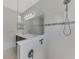 Elegant shower featuring white tile, decorative border, and glass enclosure for a luxurious feel at 253 Marcheno Way, Nokomis, FL 34275