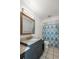 Updated bathroom featuring a modern vanity and a shower with patterned curtain at 25449 Doredo Dr, Punta Gorda, FL 33955