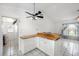 Bright eat-in kitchen with modern cabinets and tiled floors at 25449 Doredo Dr, Punta Gorda, FL 33955