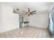Bright living room with tile floors, ceiling fans, and bar seating at 25449 Doredo Dr, Punta Gorda, FL 33955