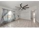 Spacious living room with tiled flooring and natural light at 25449 Doredo Dr, Punta Gorda, FL 33955