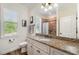 A clean bathroom features a large vanity with granite countertops and a clean white sink at 2707 Auburn Blvd, Port Charlotte, FL 33948
