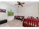 A charming bedroom features two beds and a large window to allow natural light to fill the space at 2707 Auburn Blvd, Port Charlotte, FL 33948