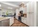 This kitchen features custom cabinets, stainless appliances, granite countertops, and eat in dining space at 2707 Auburn Blvd, Port Charlotte, FL 33948