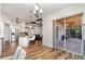 Open-concept space featuring a stylish kitchen, a breakfast bar, and access to an inviting outdoor patio at 2707 Auburn Blvd, Port Charlotte, FL 33948